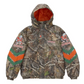 Supreme Mitchell & Ness NCAA Hooded Stadium Jacket Woodland Camo